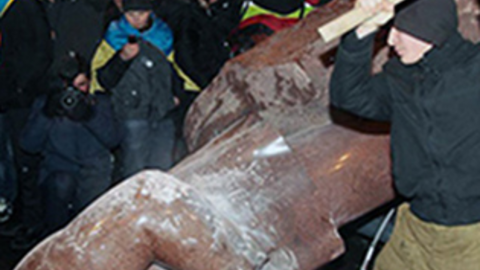 man hitting statue
